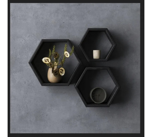 Набор трех шестигранных полок черного цвета.